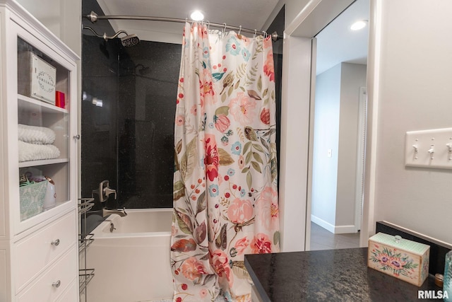 bathroom featuring shower / bath combination with curtain and vanity