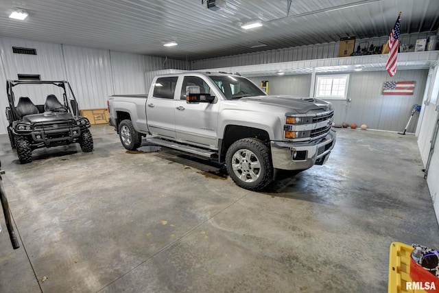 garage featuring a carport