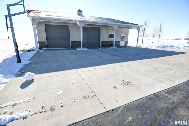 view of snow covered garage