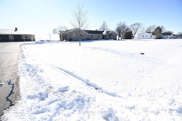 view of yard layered in snow