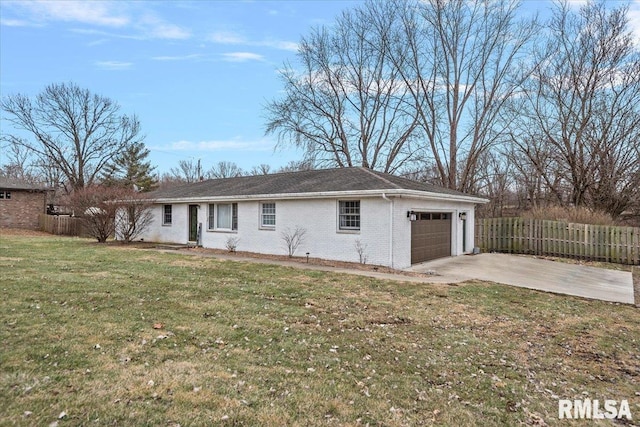 exterior space with a garage and a front lawn