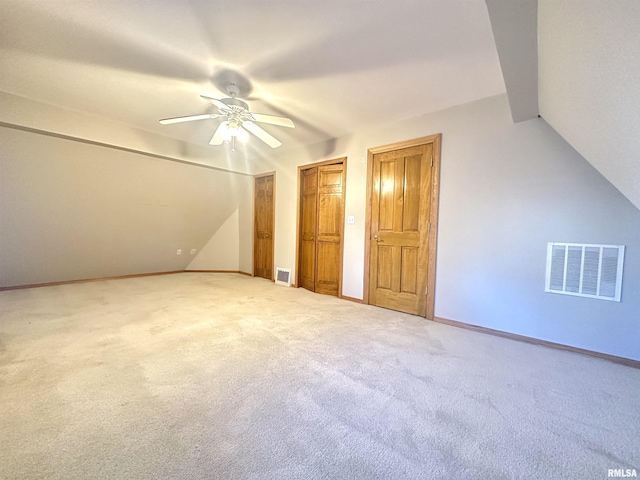 bonus room featuring carpet flooring, ceiling fan, and vaulted ceiling