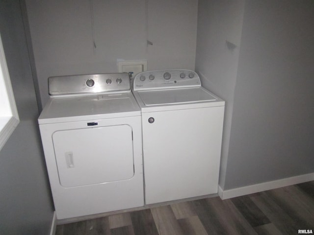 laundry room featuring washing machine and dryer and dark hardwood / wood-style floors