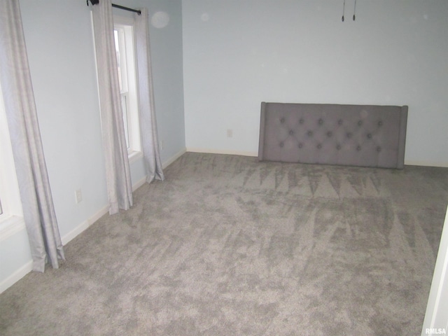 spare room with light colored carpet