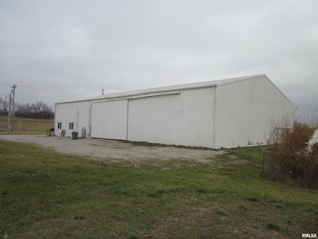 view of outdoor structure with a lawn