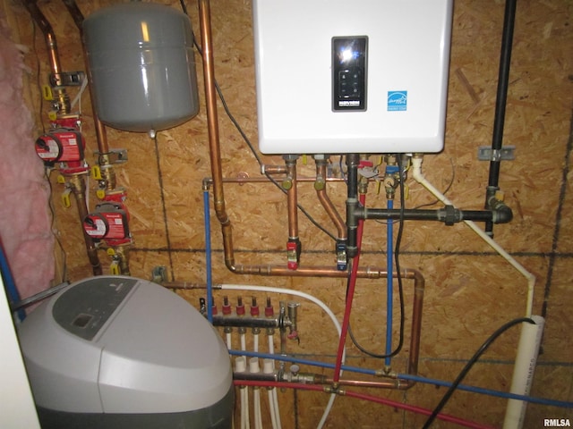 utility room with tankless water heater