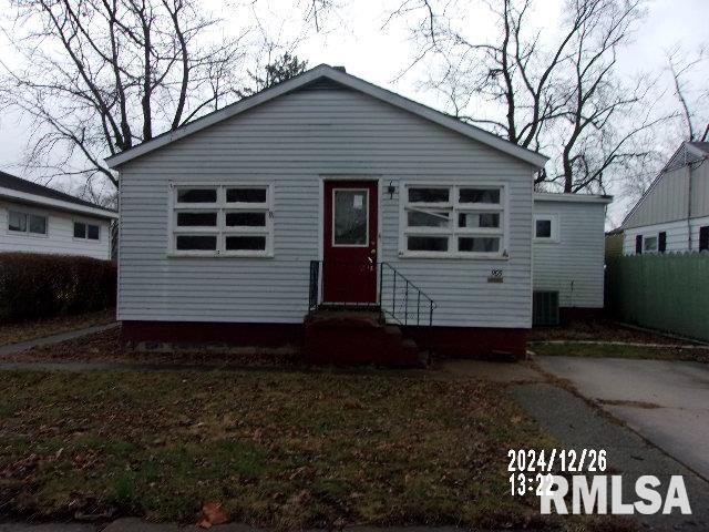 bungalow-style house featuring central air condition unit