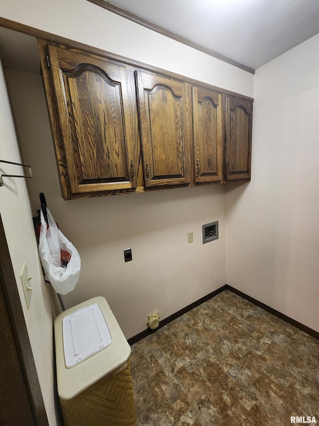 clothes washing area featuring hookup for an electric dryer, cabinets, and washer hookup