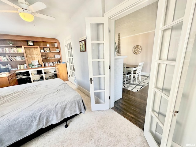 carpeted bedroom featuring french doors and ceiling fan