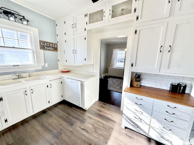 kitchen featuring white cabinetry, sink, dishwasher, and dark hardwood / wood-style floors