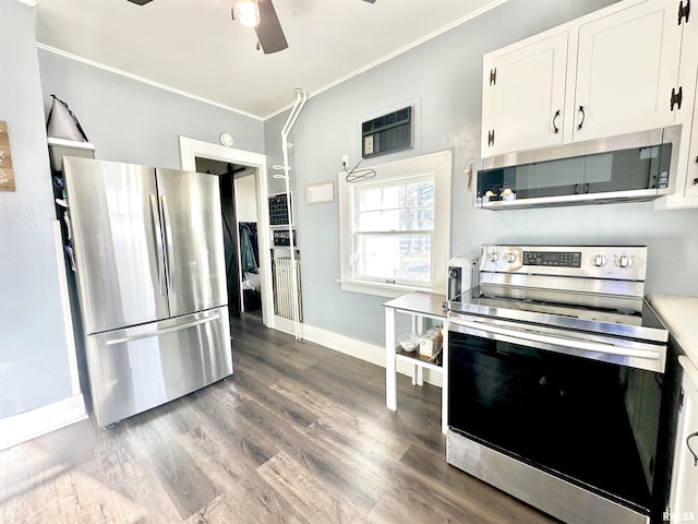 kitchen featuring white cabinetry, ceiling fan, stainless steel appliances, hardwood / wood-style floors, and ornamental molding