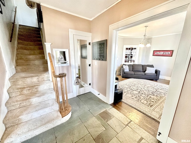 interior space with crown molding and an inviting chandelier