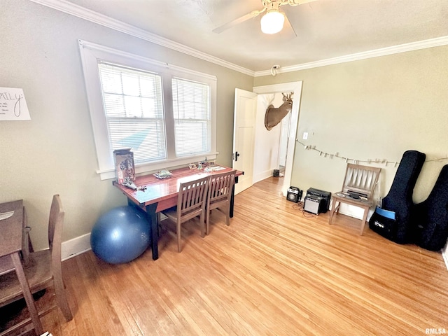 office area featuring light wood-type flooring, ceiling fan, and ornamental molding