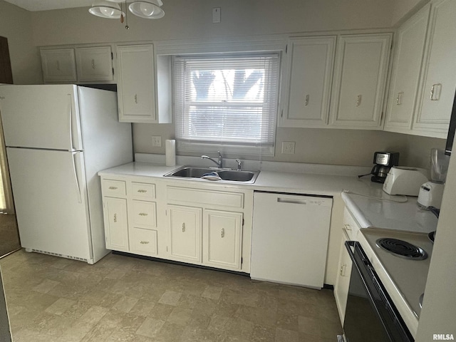 kitchen with sink, white appliances, and white cabinets