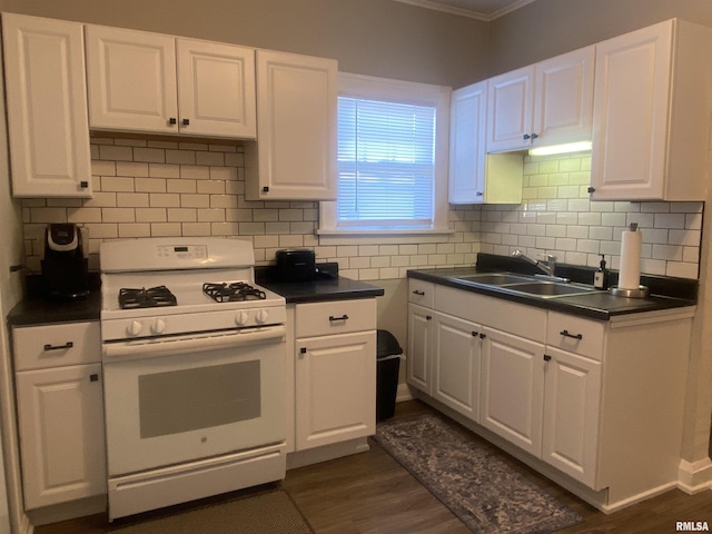 kitchen with white cabinetry, dark hardwood / wood-style flooring, white gas range, and sink