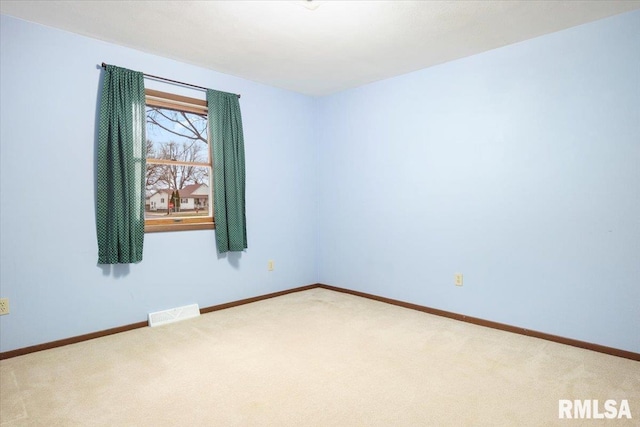 spare room featuring carpet flooring