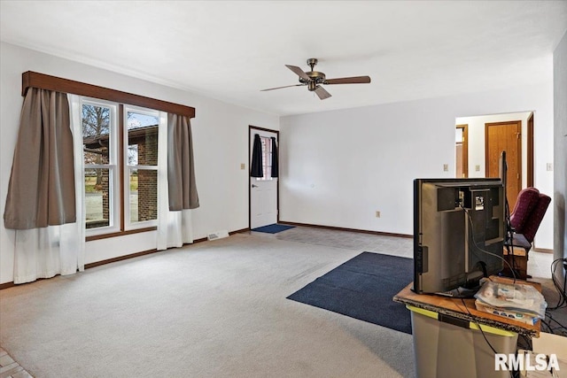 misc room with ceiling fan and carpet flooring