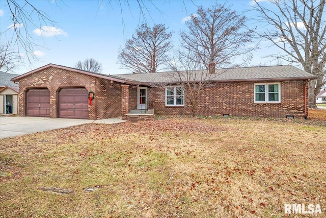 ranch-style home with a garage and a front yard