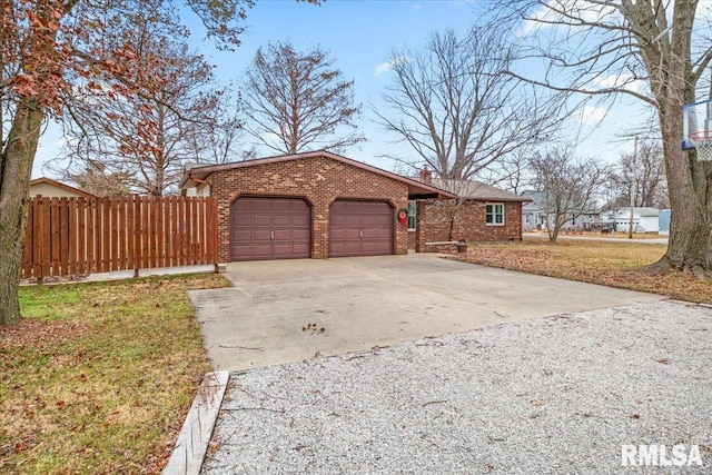 exterior space with a garage and a front lawn