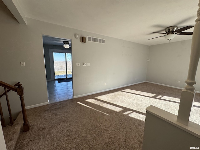 carpeted empty room with ceiling fan