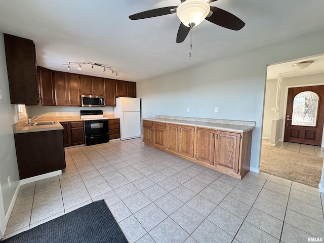 kitchen with ceiling fan, white fridge, electric range, sink, and light tile patterned floors