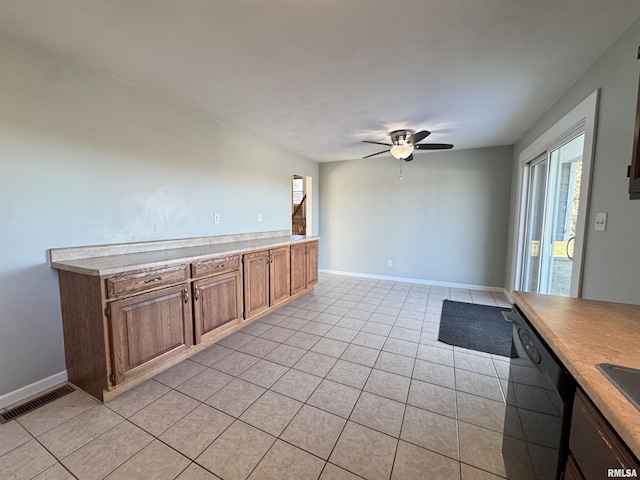 kitchen featuring ceiling fan, dishwasher, and light tile patterned flooring