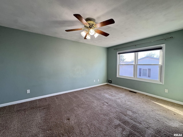 carpeted empty room with ceiling fan