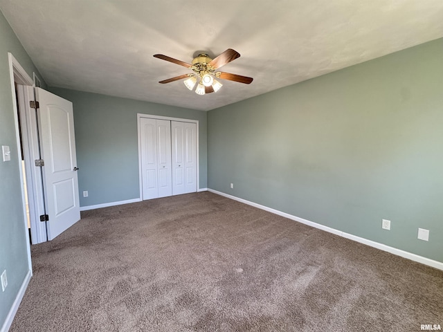 unfurnished bedroom featuring ceiling fan, a closet, and carpet