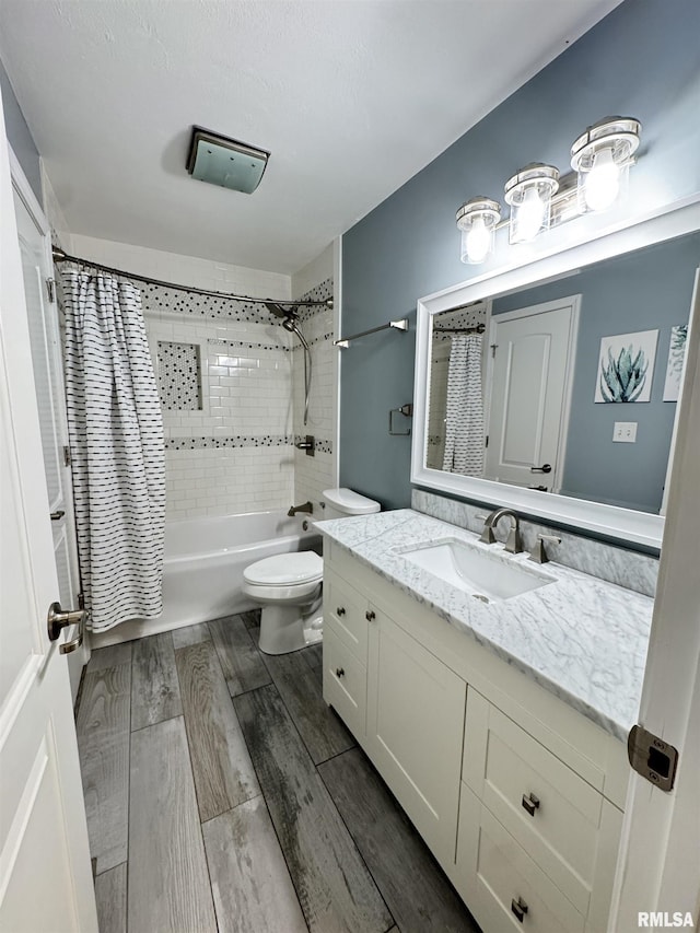 full bathroom featuring toilet, vanity, and shower / tub combo