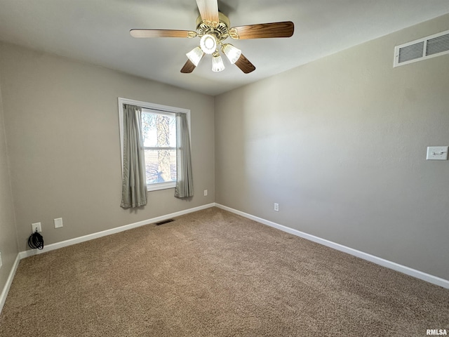 empty room featuring carpet floors and ceiling fan