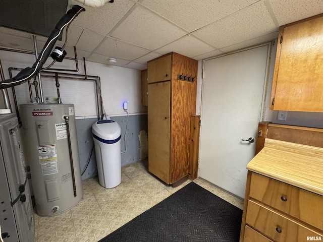 utility room with electric water heater