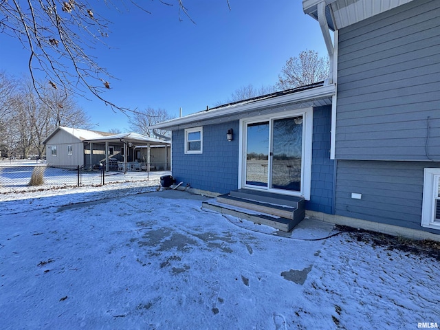 view of snow covered house