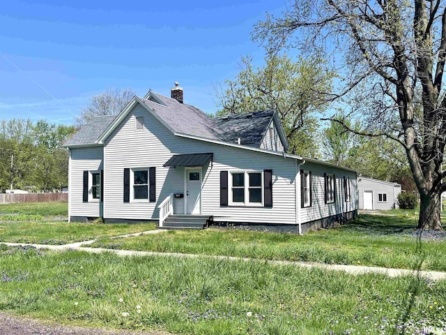 bungalow with fence, a chimney, and a front yard
