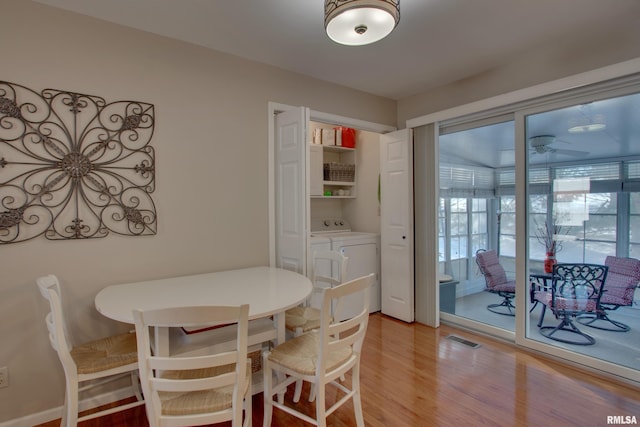 dining room with light hardwood / wood-style floors and ceiling fan