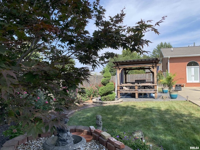 view of yard featuring french doors, a patio area, fence, and a pergola