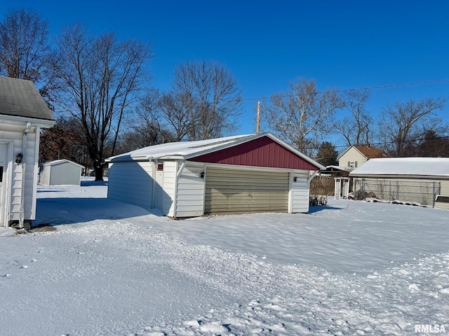 view of snow covered garage