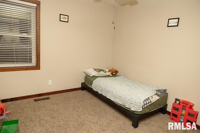 carpeted bedroom featuring ceiling fan