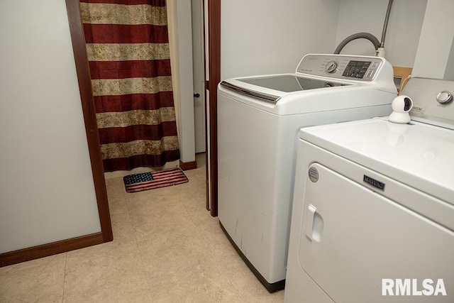 washroom featuring separate washer and dryer