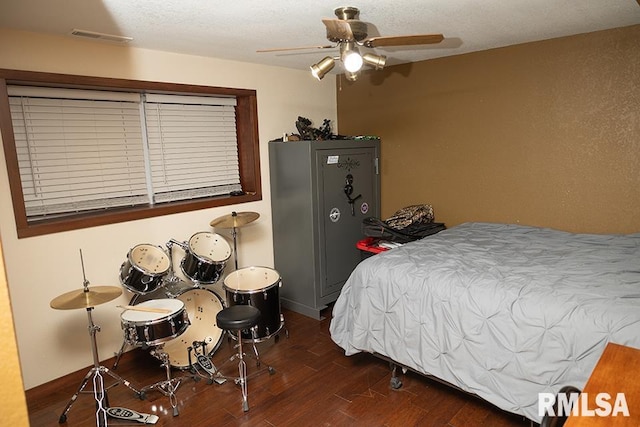 bedroom featuring dark wood-type flooring and ceiling fan