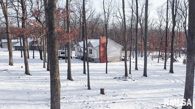 view of yard layered in snow