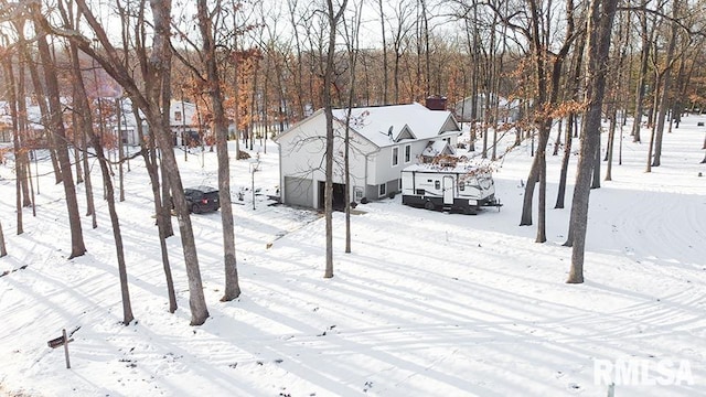 view of yard layered in snow