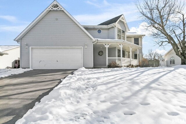 view of front of house featuring a garage and covered porch