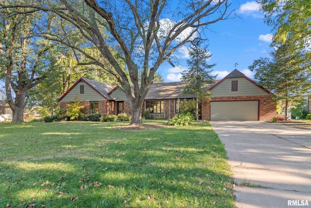 view of front of property featuring a garage and a front lawn