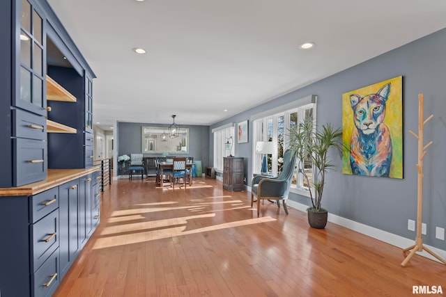 living room with hardwood / wood-style flooring and a chandelier