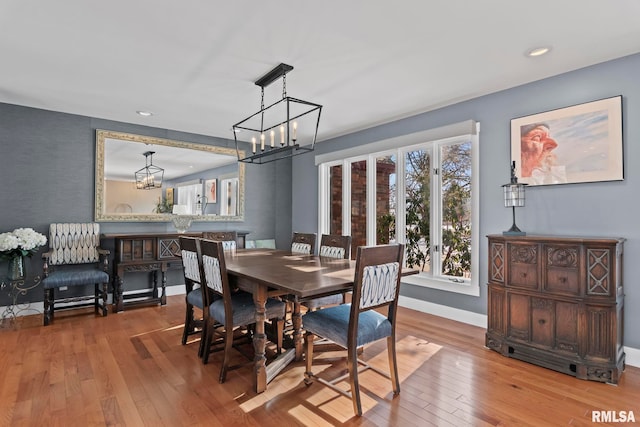 dining room featuring an inviting chandelier and hardwood / wood-style floors