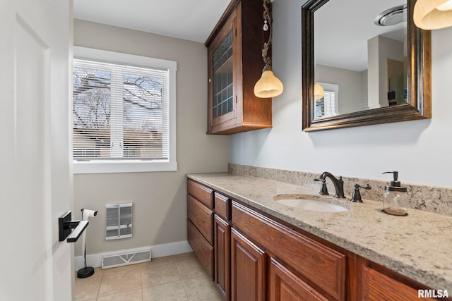 bathroom featuring tile patterned flooring and vanity