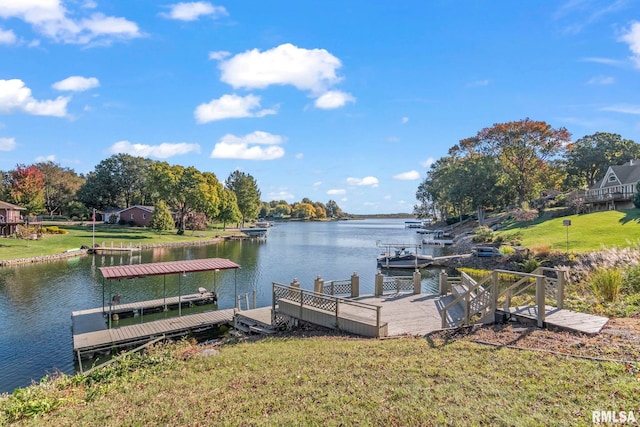 dock area featuring a yard and a water view