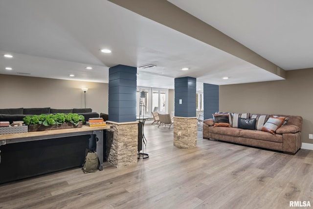 living room with light hardwood / wood-style floors