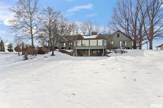 view of snow covered house