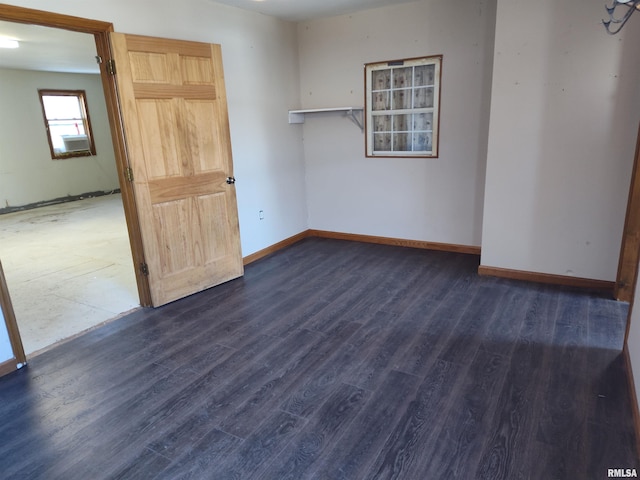 spare room featuring dark hardwood / wood-style flooring